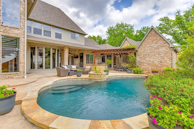 pool featuring exterior bar, a patio, ceiling fan, and an outdoor living space