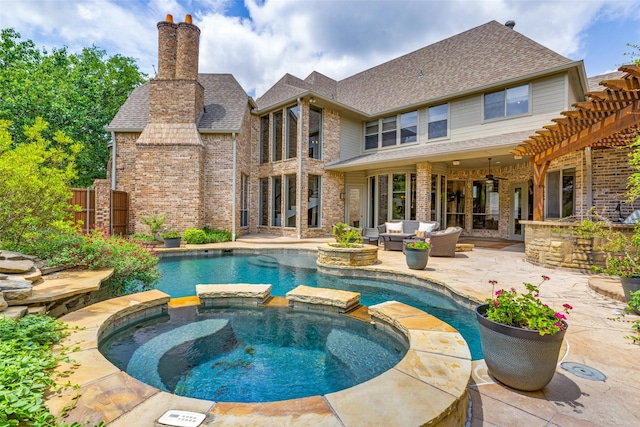 view of swimming pool with ceiling fan, a pool with connected hot tub, an outdoor hangout area, and a patio area