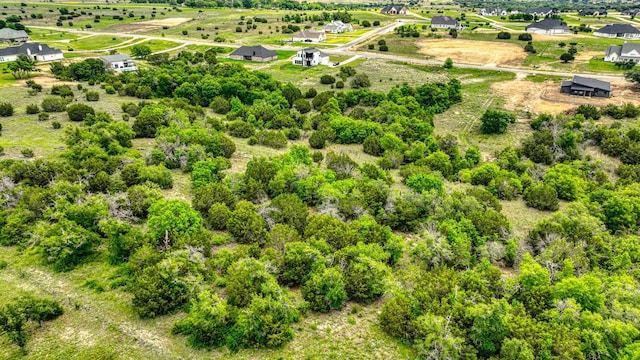 birds eye view of property with a rural view