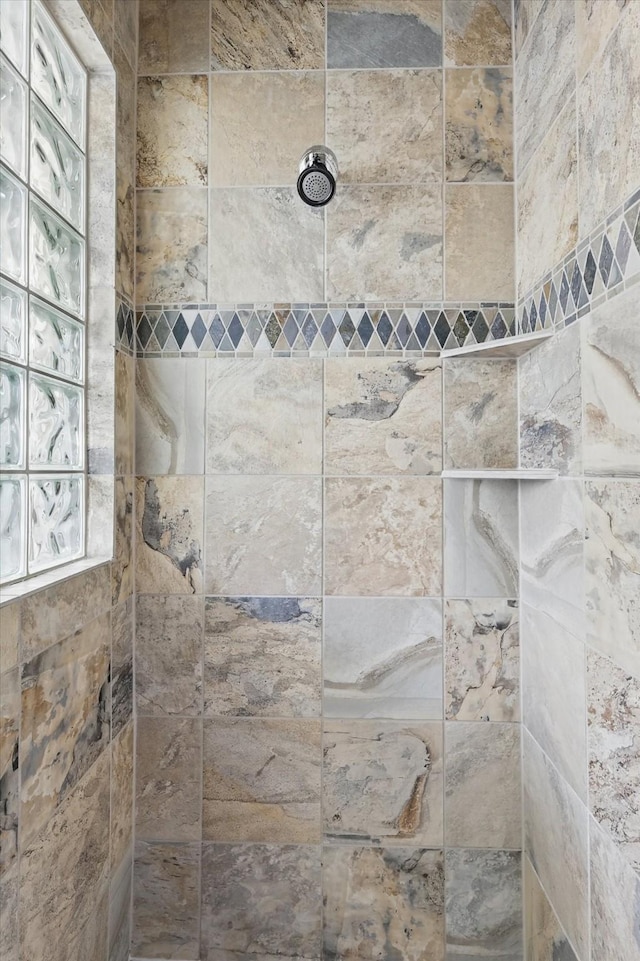 full bath featuring a tile shower