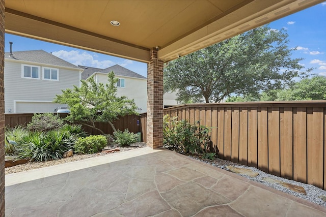view of patio featuring fence