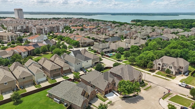 aerial view with a water view and a residential view