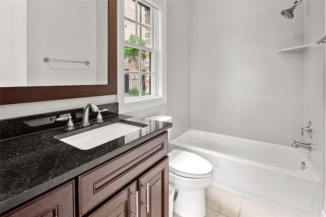bathroom featuring vanity, bathtub / shower combination, and toilet
