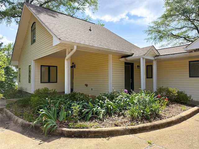 view of front of property with roof with shingles