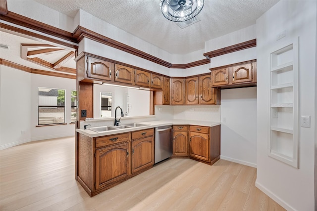 kitchen with stainless steel dishwasher, a textured ceiling, and brown cabinetry