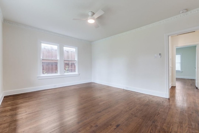 spare room featuring a ceiling fan, ornamental molding, and wood finished floors
