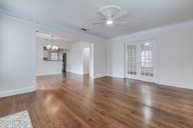 unfurnished living room with crown molding, a wealth of natural light, french doors, and visible vents