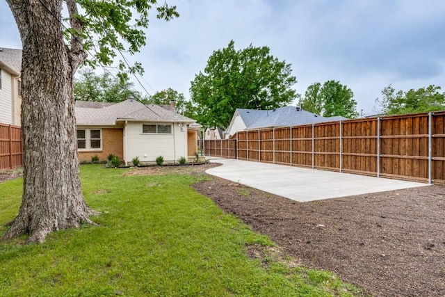 view of yard featuring a patio and a fenced backyard