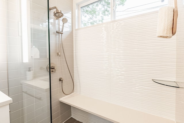 bathroom featuring a tile shower