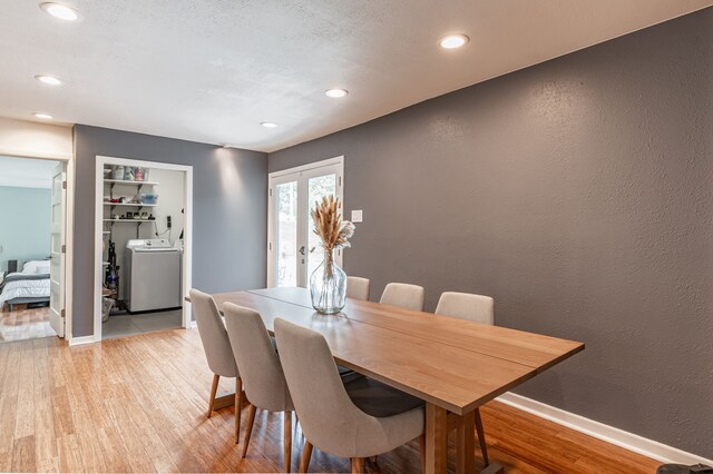 dining space featuring recessed lighting, washer / dryer, light wood finished floors, and baseboards