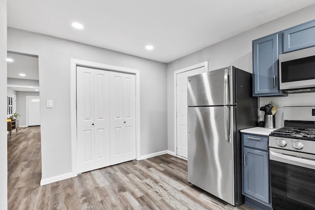 kitchen with stainless steel appliances, baseboards, recessed lighting, and light wood-type flooring