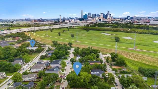 birds eye view of property featuring a city view