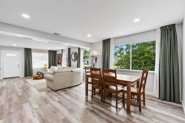 dining area featuring recessed lighting, plenty of natural light, light wood finished floors, and visible vents
