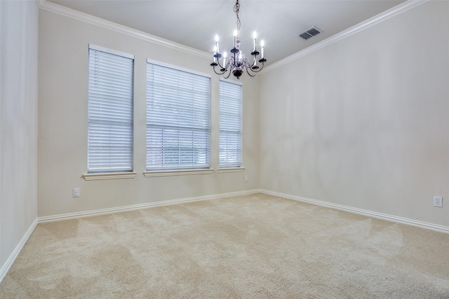 spare room with visible vents, baseboards, an inviting chandelier, ornamental molding, and carpet flooring