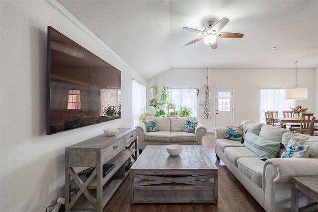 living area featuring baseboards, a ceiling fan, dark wood-style flooring, and lofted ceiling
