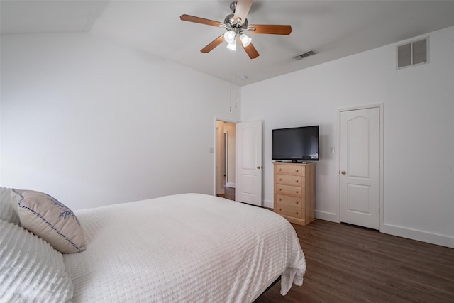 bedroom featuring baseboards, ceiling fan, wood finished floors, and visible vents