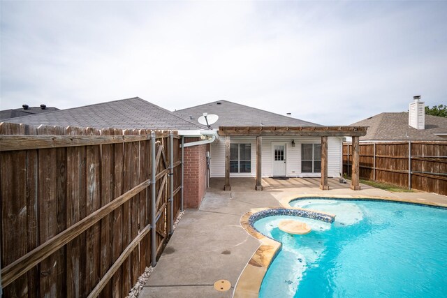 view of pool with a fenced backyard, a fenced in pool, a patio, and an in ground hot tub