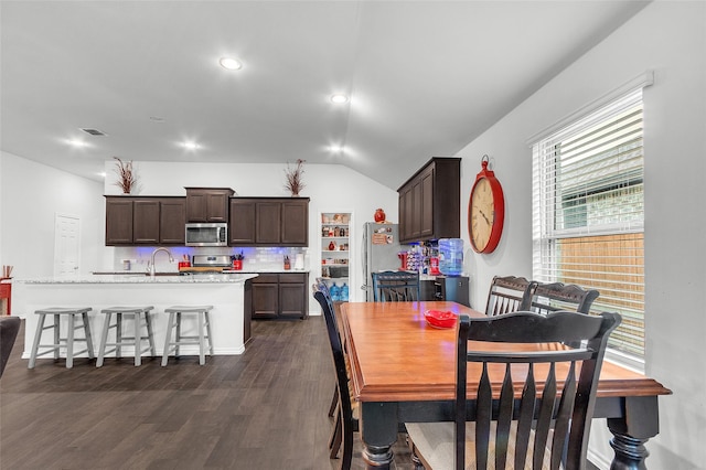 dining room with recessed lighting, visible vents, dark wood finished floors, and lofted ceiling
