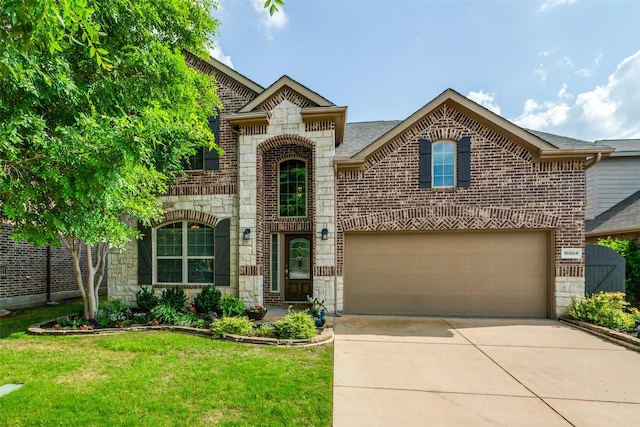 view of front facade with brick siding, a front lawn, driveway, and stone siding
