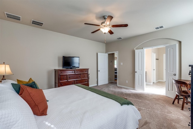 bedroom featuring visible vents and light colored carpet