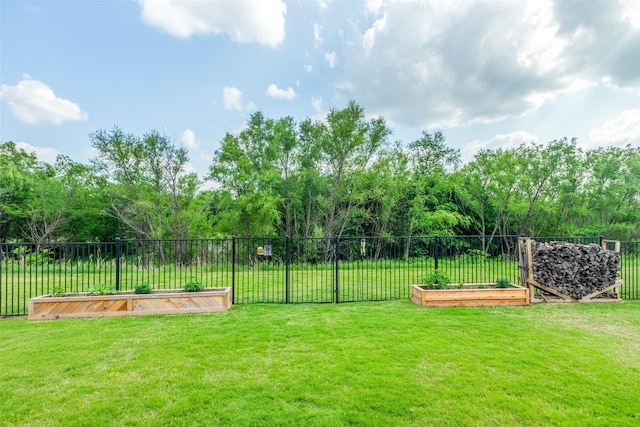 view of yard featuring a garden and fence