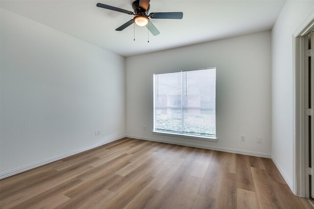 2372 Homewood Ln, Grand Prairie, TX 75050 - spare room featuring wood finished floors, baseboards, and a ceiling fan