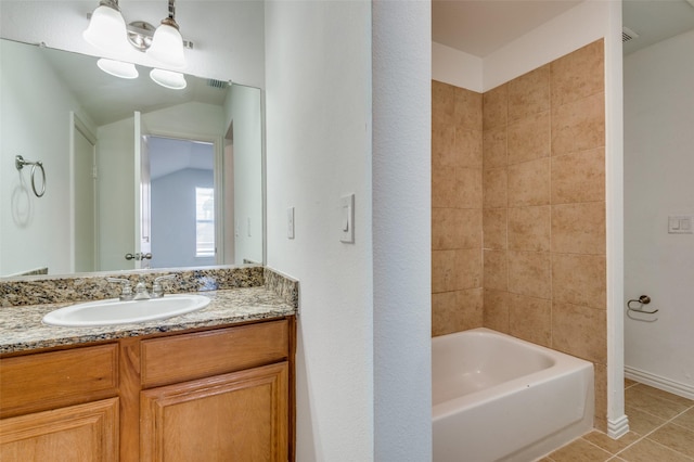 2372 Homewood Ln, Grand Prairie, TX 75050 - bathroom with tile patterned floors, vanity, and tub / shower combination