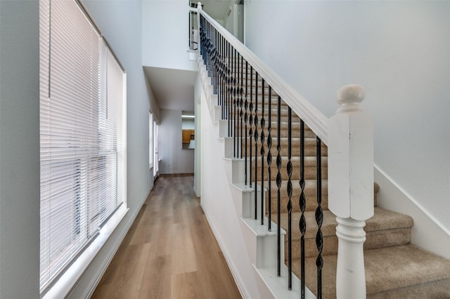 2372 Homewood Ln, Grand Prairie, TX 75050 - stairway with wood finished floors and a towering ceiling