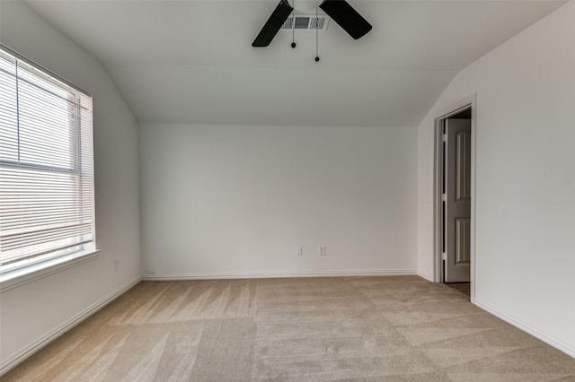 2372 Homewood Ln, Grand Prairie, TX 75050 - spare room featuring lofted ceiling, ceiling fan, light carpet, healthy amount of natural light, and baseboards