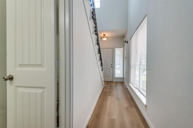 2372 Homewood Ln, Grand Prairie, TX 75050 - hallway featuring light wood finished floors and baseboards