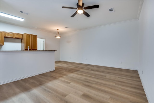 2372 Homewood Ln, Grand Prairie, TX 75050 - unfurnished living room with crown molding, ceiling fan, light wood finished floors, and baseboards