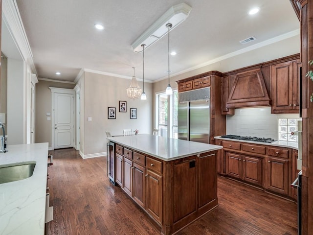 kitchen featuring stainless steel appliances, a sink, custom exhaust hood, recessed lighting, and dark wood-style flooring