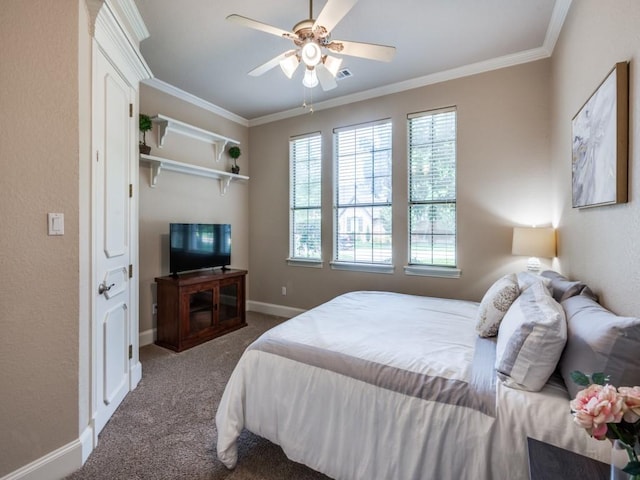bedroom with carpet floors, crown molding, baseboards, and ceiling fan