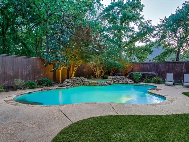 view of pool featuring a fenced backyard, a hot tub, and a patio area
