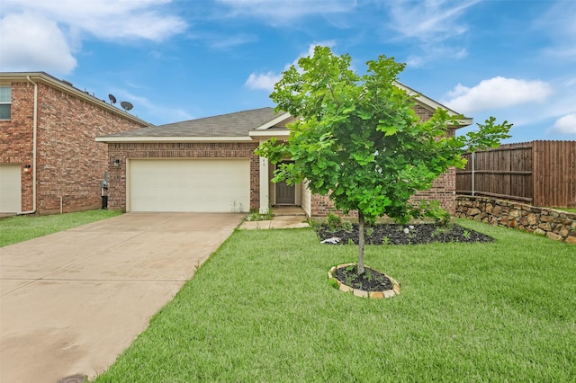 view of front of house with a garage, a front lawn, fence, brick siding, and driveway