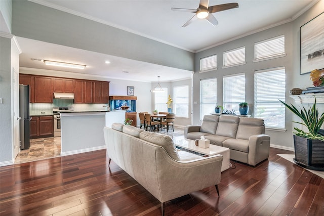 living room with crown molding, ceiling fan, plenty of natural light, and hardwood / wood-style flooring
