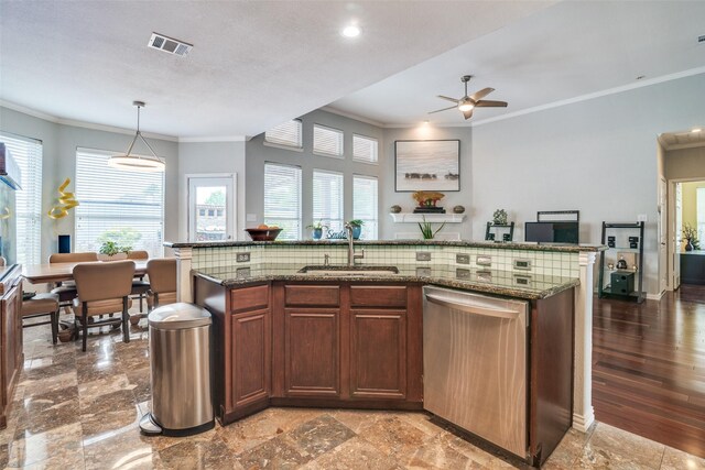 kitchen featuring crown molding, visible vents, a sink, and dishwasher