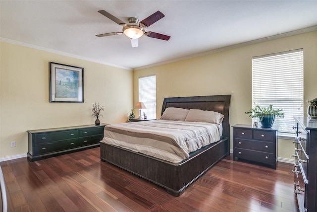 bedroom featuring crown molding, baseboards, ceiling fan, and dark wood-style flooring