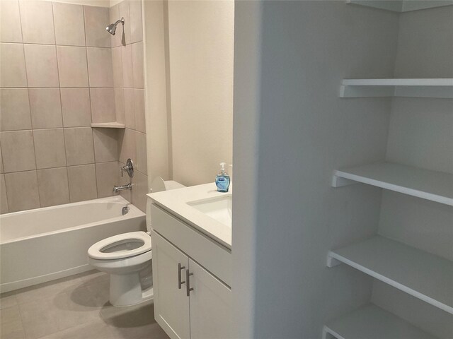 full bath featuring shower / bath combination, tile patterned floors, vanity, and toilet