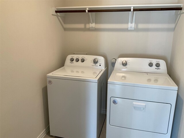 laundry area with laundry area and independent washer and dryer