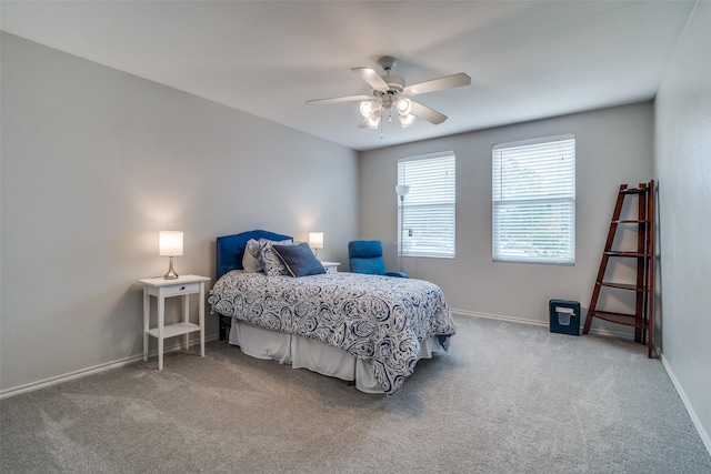 carpeted bedroom with baseboards and ceiling fan