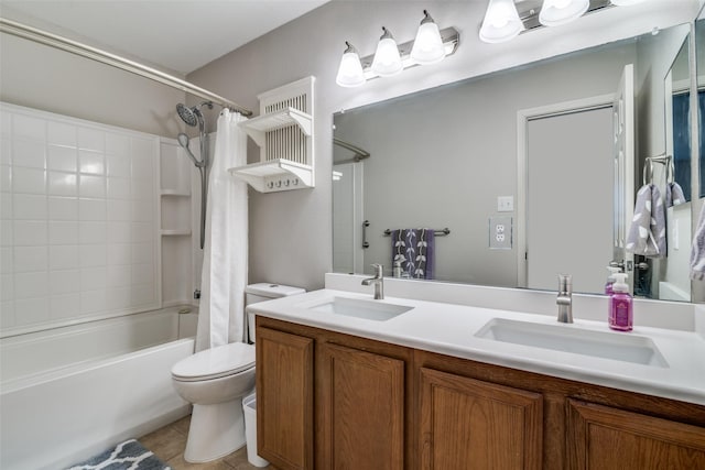 full bathroom featuring a sink, tile patterned floors, shower / tub combo with curtain, and toilet