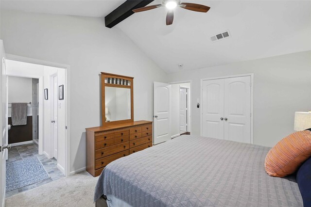 bedroom featuring visible vents, baseboards, a closet, vaulted ceiling with beams, and carpet