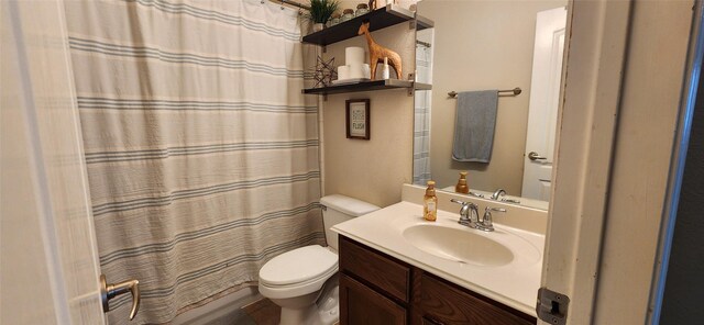 bathroom with toilet and vanity