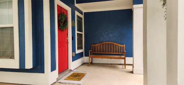 view of exterior entry with a porch