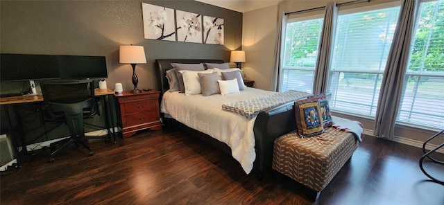 1213 Charleston Ln, Savannah, TX 76227 - bedroom featuring dark wood-type flooring, multiple windows, baseboards, and an office area