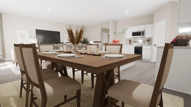 dining space featuring recessed lighting, light wood finished floors, and baseboards