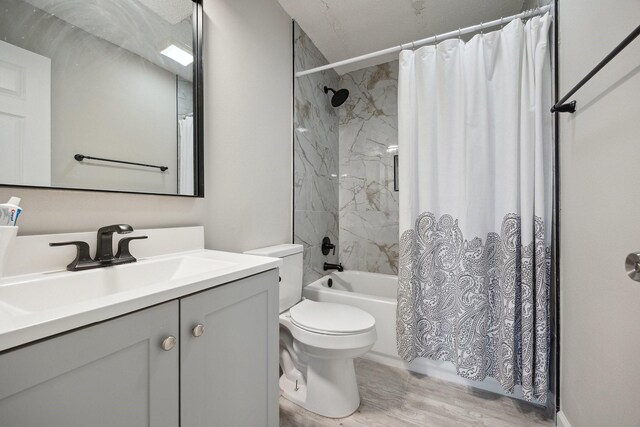1706 Delaford Cir, Carrollton, TX 75007 - full bath with vanity, shower / bath combo, toilet, and wood finished floors