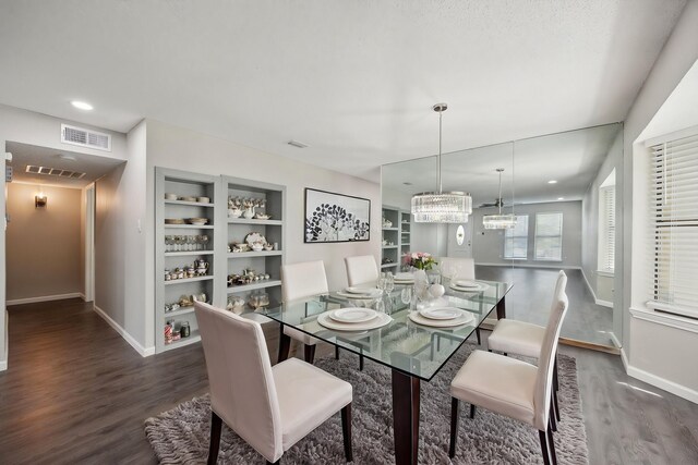1706 Delaford Cir, Carrollton, TX 75007 - dining area with baseboards, dark wood finished floors, built in features, and visible vents