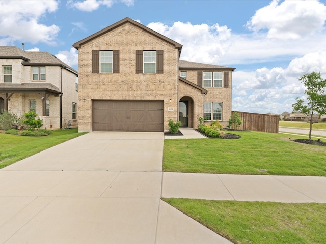 3601 Keechi Creek Dr, Celina, TX 75078 - traditional-style house with brick siding, fence, an attached garage, concrete driveway, and a front lawn